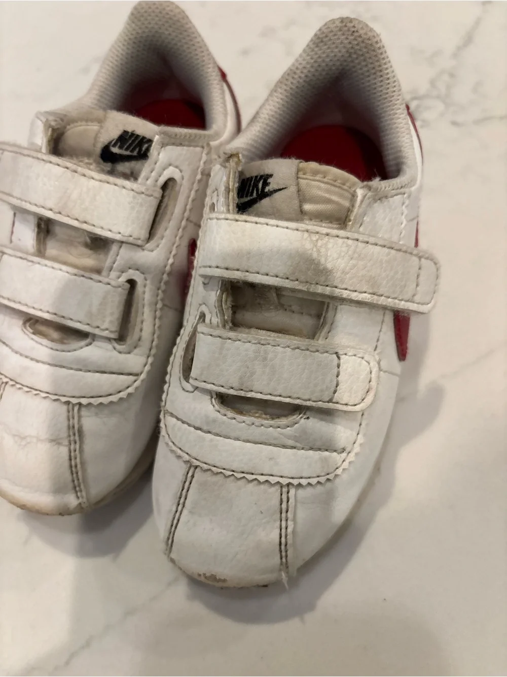 Nike Kids White Sneakers with Red Swoosh